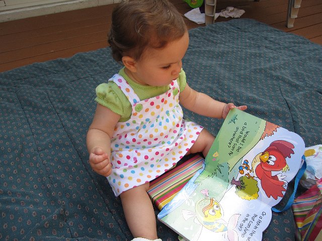 IMG_8649.JPG - She's reviewing one of her gifts ...