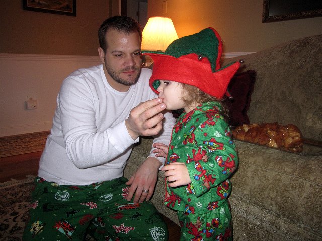 IMG_2316b.jpg - Our little elf trying Monkey Bread for the first time.