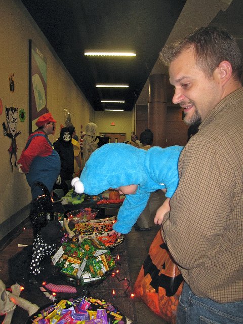 IMG_6736.jpg - This is the line up of goodies at the Axcelis Halloween Party.  Nathan learned the ropes pretty quickly.