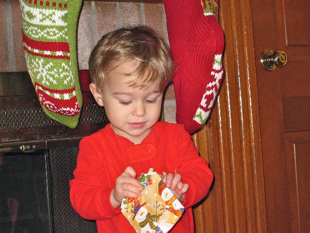 IMG_7586.jpg - Nathan's first stocking stuffer is ...