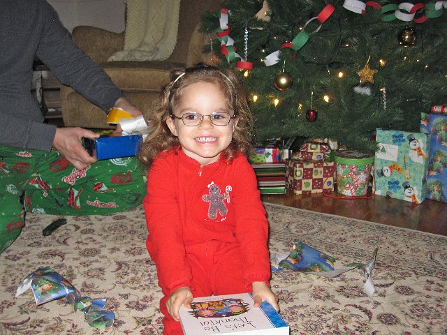 IMG_7599.jpg - Catherine received several books this Christmas and she's excited about each one!