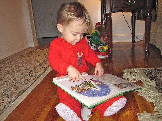IMG_7607.jpg - Nathan enjoying the Charlie Brown Christmas book recorded by Grandpa.