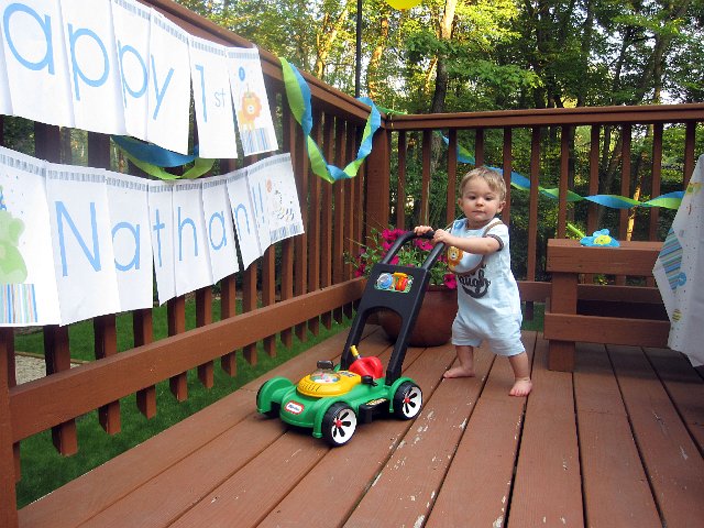 IMG_4229b.jpg - Nathan testing out one of his new toys.  Anything that goes, is a hit with this guy!