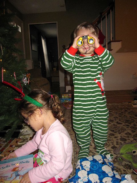 IMG_3425.jpg - Nathan received binoculars from Santa too.  (Now he no longer needs to use the homemade ones Mom made from toilet paper rolls, tape and yarn.)