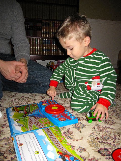 IMG_3438.jpg - Ahhh, a book with train sounds.  You can't go wrong with that and this guy!  Thanks Grandpa