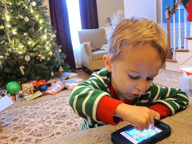 IMG_6158.jpg - And Nathan is already playing with his phone.