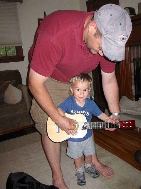 IMG_0873.jpg - His very first guitar .. thank you, Grandmum and Grandpop.