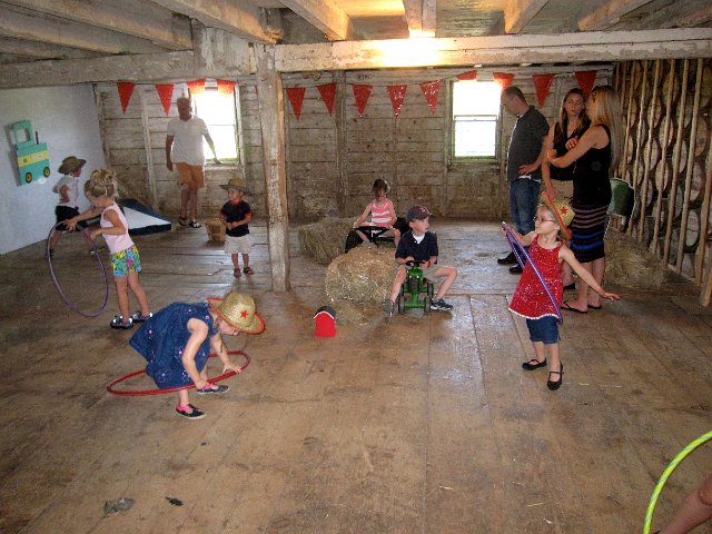 IMG_6688.jpg - Our fun was underway with "tractor" rides, hula hoop dancing and bean bag tosses inside the barn.