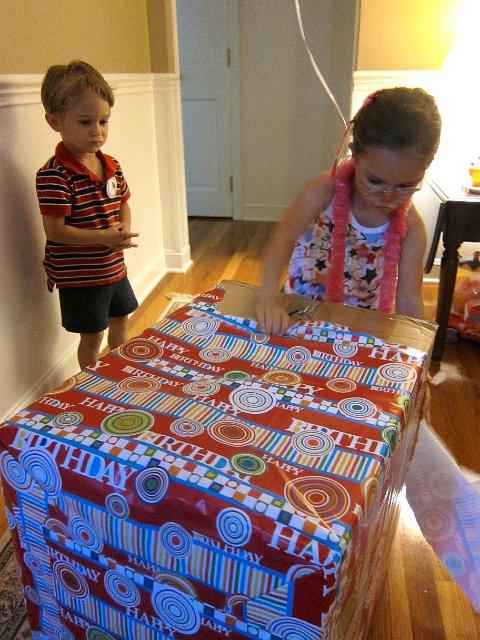 IMG_7368.jpg - And a big box from Mom & Dad.  (Nathan is a little discouraged because Catherine didn't want to share in the ripping of the wrapping paper.)