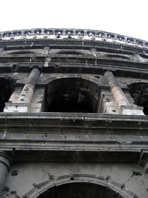 Colosseum-15.JPG - Although it is now in a severely ruined condition due to damage caused by earthquakes and stone-robbers, the Colosseum has long been seen as an iconic symbol of Imperial Rome and is one of the finest surviving examples of Roman architecture.