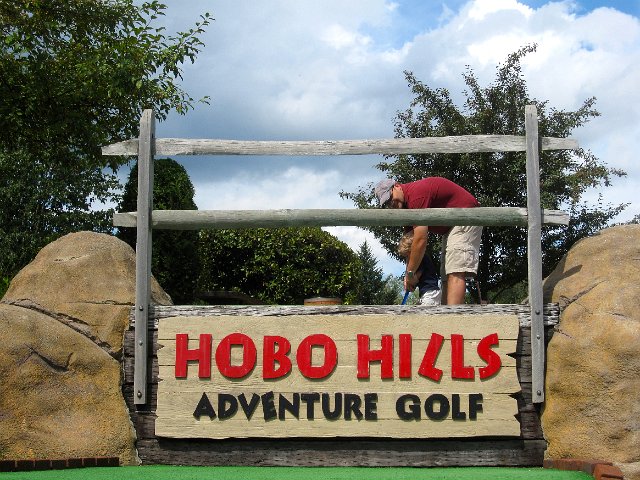 IMG_1779.jpg - Following the train ride, the kids (along with some instructions from Mom and Dad) did a round of miniature golf at Hobo Hills.