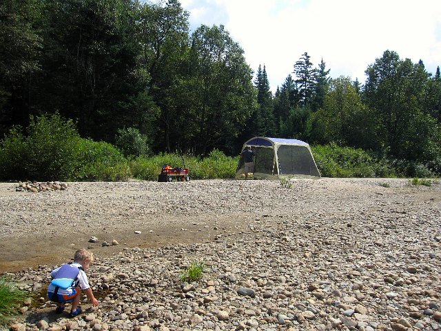 IMG_1728.jpg - Nathan continue his rock search and throw play time while Daddy sets up our little riverside shelter (and break from the sun).
