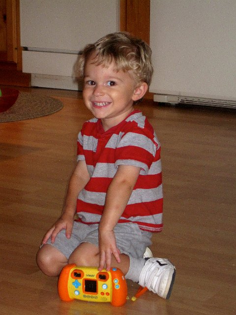 IMG_1801.jpg - Nathan and one of his favorite (and most recent) toys, the camera.
