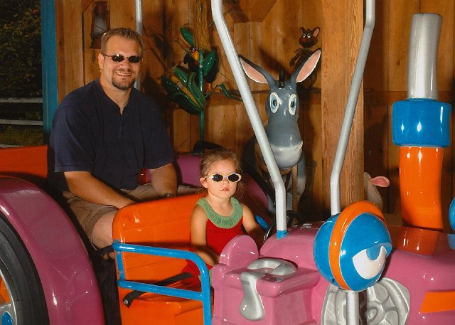 IMG.jpg - Catherine got to drive a PINK one while on the Eggs-traordinary Farm Tractor ride.